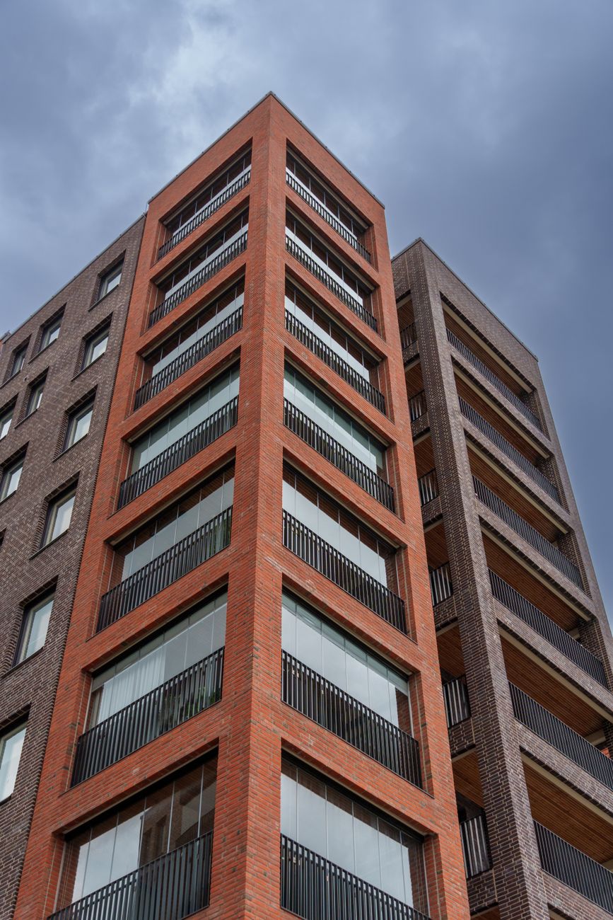 Modern brick residential building seen from below